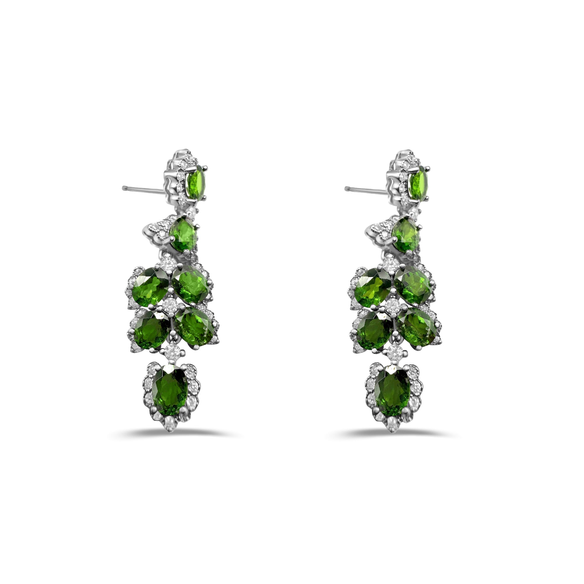 Pair of green gemstone earrings on a white background